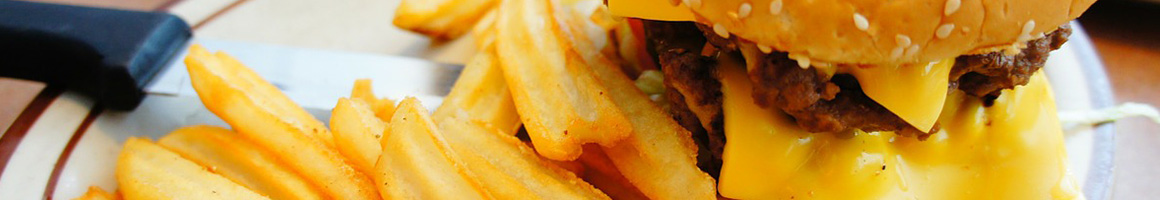 Eating Burger at Leo's Burgers, restaurant in Bakersfield, CA.